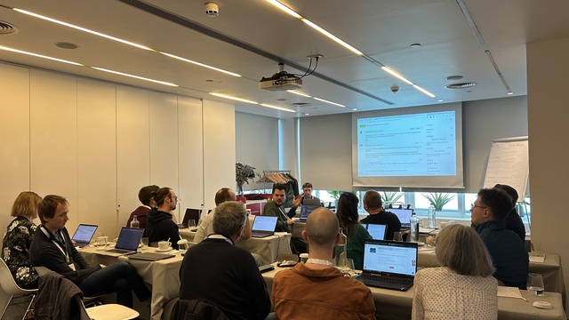 Developers exchanging ideas at the DMP IF Hackathon